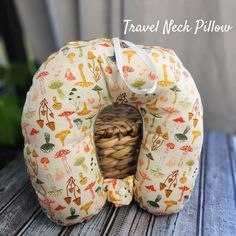 a travel neck pillow with an animal print on it and a basket in the middle