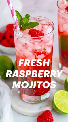 two glasses filled with raspberry lemonade and limes next to strawberries