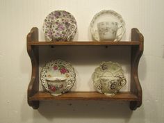 a shelf with plates and cups on it