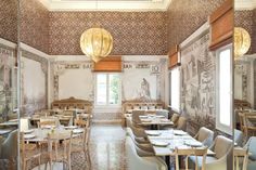 an empty dining room with tables and chairs