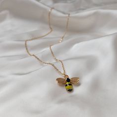 Don't miss out on this beautiful gold bumble bee necklace. It works with a large variety of looks and add a bit of sparkle to your outfit. MORE jewellery pieces avaliable on our shop! Any questions please message we are happy to help. Free postage in UK Thank you for shopping with us Heather&Bumble 📪Follow us at: Instagram: heatherandbumble Twitter: Heather_Bumble Pintrest: Heather & Bumble Gold Bumble Bee Necklace - Gold Jewellery, Accessories, Gold Bee Necklace, Bee Jewelley, Gold Necklace, Pendant Necklace, Insect Jewellery Gold Necklace Pendant, Bumble Bee Necklace, Gold Schmuck, Accessories Gold, Insect Jewelry, Gold Bee, Bee Necklace, Tiny Earrings, Jewelry Card