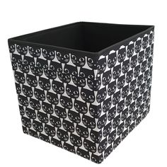 a large black and white box with cats on the front, sitting in front of a white background