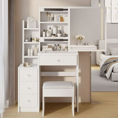 a bedroom with a bed, desk and mirror