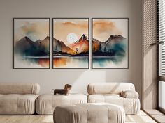 a living room with three paintings on the wall