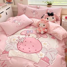 a hello kitty bed set with pink sheets and pillows