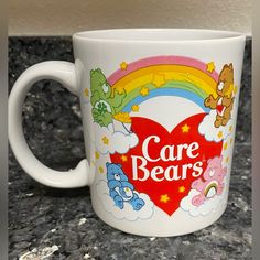 a care bears coffee mug sitting on top of a counter