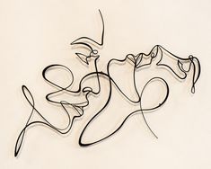 a drawing of two faces on a white background with the word love spelled in black ink