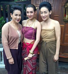 three young women standing next to each other