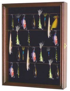 a collection of fishing lures displayed in a display case