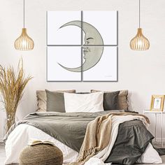 a bedroom with three pictures hanging on the wall