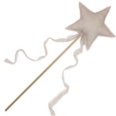 a white star shaped wand on a stick