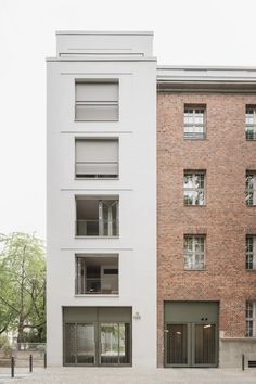 an apartment building with several balconies on each floor