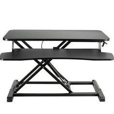 a black table with two shelves on it and one shelf attached to the back of the table