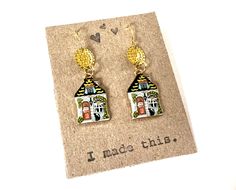 "Love these whimsical house earrings with a black cat! They will go with so many outfits and they are lightweight and pure fun! The charms and ear wires are gold toned and nickel free. I can swap out solid sterling ear wires for people with really sensitive ears. These earrings dangle about 1.25\" long. A great gift for that special someone who has everything! Check out my other mixed metal earrings! https://www.etsy.com/shop/HeidiKindFinds?ref=hdr_shop_menu&search_query=mixed+metal+earrings" House Earrings, Whimsical House, Mixed Metal Earrings, Colorful Home, Funky Earrings, Home Black, Repurposed Jewelry, Vintage Lettering, Fabric Ribbon