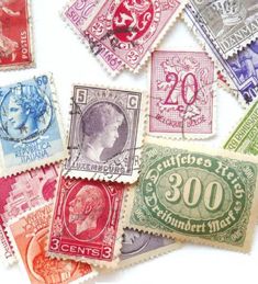 many different colored stamps on a white surface