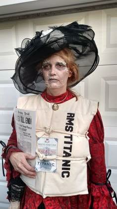 a woman dressed up in costume and holding a newspaper with words written on her face