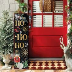 a red door decorated with christmas decorations