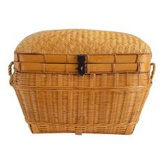 a large wicker basket with leather handles