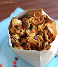 a paper bag filled with cereal on top of a blue plate