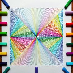 an art project with crayons and colored pencils