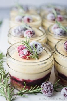 desserts in small glass jars with sprigs on top