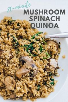 mushroom spinach quinoa is served on a white plate with a silver spoon