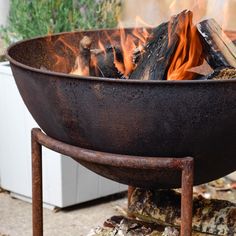 a large metal bowl sitting on top of a fire pit