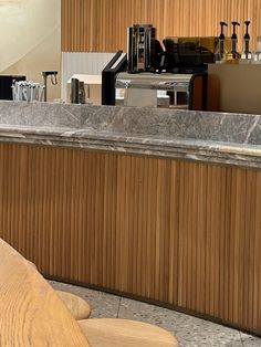 an empty counter in a restaurant with wood paneling