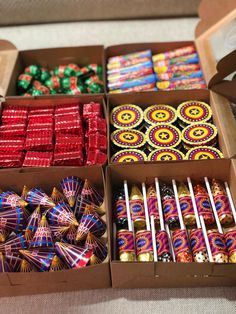 several boxes filled with different types of candies and chocolates on top of a table