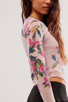 Effortlessly essential with a slight ethereal touch, this timeless top is featured in a fitted, long sleeve silhouette with stunning floral printing throughout, semi-sheer sleeves, and defined seaming for added dimension. **Fit:** Fitted, classic style **Features:** Scoop neckline, defined seaming, semi-sheer sleeves **Why We | Betty's Garden Top by Free People in Red, Size: XS Floral Printing, Fitted Long Sleeve, Chic Fall Outfits, Mesh Shirt, Free People Clothing, Sheer Sleeves, Cool Tees, Floral Shirt, Workout Tops