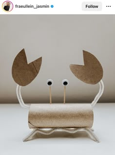 an image of a cardboard crab with two eyes