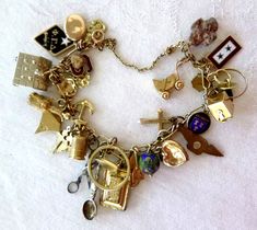 7 inches long, spring ring & security chain. 37 charms, many marked 10K, a couple marked 925, 2 marked GP Bracelet marked 10K 42.6 grams Insured shipping Vintage Gold Charms, Ring Security, Vintage Charm Bracelet, Unlimited Money, Gold Charm Bracelet, Junior Year, Locket Charms, Stylish Jewelry, Fairy Core