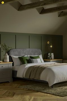 a bedroom with a bed, nightstands and lamps