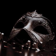 a masquerade mask sitting on top of a table