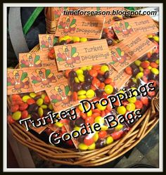 a basket filled with lots of candy sitting on top of a table