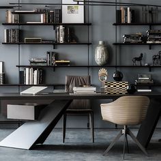 an office with bookshelves, desk and chair in the middle of the room