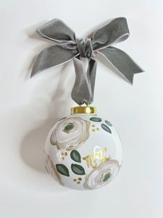 an ornament with a bow hanging from it