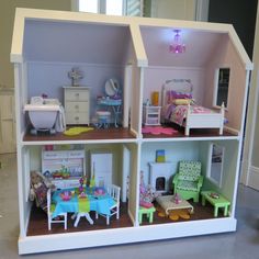 a doll house with furniture and accessories in it