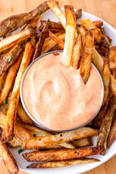 A plate of golden, crispy French fries surrounding a bowl of creamy dipping sauce, garnished with fresh herbs. Best Fry Sauce, French Fry Dipping Sauce, Fry Dipping Sauce, Fry Dip, French Fry Sauce, Easy Peach Pie, Applesauce Cookies, Citrus Cake, Gooey Butter