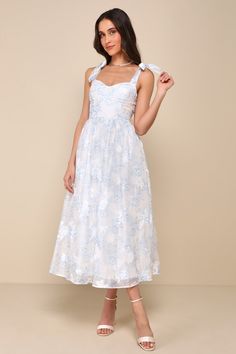 There's no better start to a perfect occasion than the Lulus Beautifully Adored White Floral Burnout Tie-Strap Midi Dress! Lightweight woven fabric, with a darling floral print and burnout texture throughout, shapes tying shoulder straps that support a sweetheart neckline and a bustier-style bodice with seamed cups. Fitted waist tops a skater skirt that ends at a midi hem. Hidden zipper/clasp at back. Fit: This garment fits true to size. Length: Mid-calf length. Size medium measures 49" from adj Chitenge Dresses, Knot Tie Dress, Shower Dress For Bride, Graduation Attire, Blue Floral Sundress, Midi Dress Floral, Floral Bustier, Bridal Shower Outfit, Bridal Shower Dress