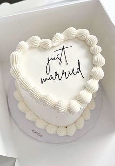 a heart - shaped cake with the words just married written on it in black ink