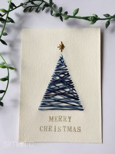 a card with a christmas tree on it