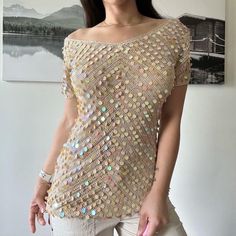 90s vintage gold knit sequins party blouse by L'officiel excellent condition one of a kind will beauty fit a size small to medium pit to pit 18" full length 30" Glamorous Gold Tops For Summer, Gold Summer Party Top, Summer Party V-neck Crochet Top, Summer V-neck Crochet Top For Party, V-neck Crochet Top For Summer Party, Gold Short Sleeve Top With Sequins, Gold Sequined Short Sleeve Top, Gold Sequin Short Sleeve Top, Gold Short Sleeve Tops With Sequins