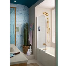 a bathroom with blue walls and white fixtures