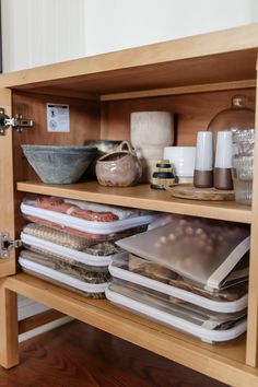 a wooden cabinet filled with lots of items