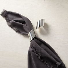 a scarf with two metal clips attached to it