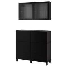 a black cabinet sitting next to a white wall