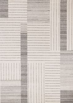 an area rug with black and white stripes on it's sides, in the shape of rectangles