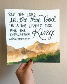 a hand holding up a card with the words, but the lord is the true god he is the living god and the everlasing jeremah 101