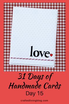 a red and white checkered table cloth with the words love in black on it